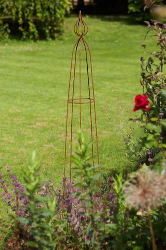 Rusty metal obelisk - metal, plant